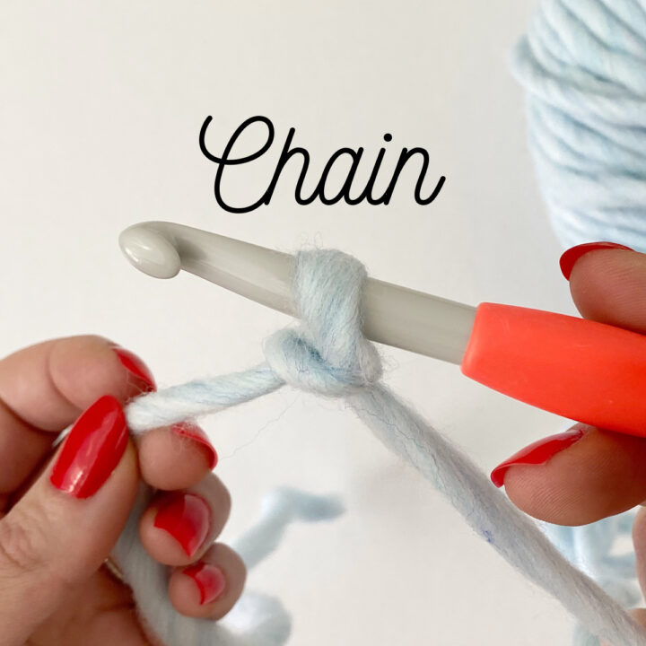 Hook and yarn making a chain