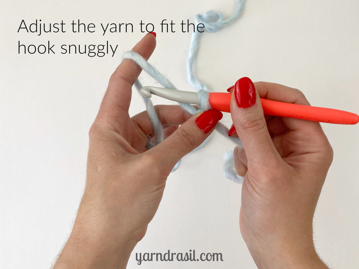 Adjust the yarn to fit the hook snuggly